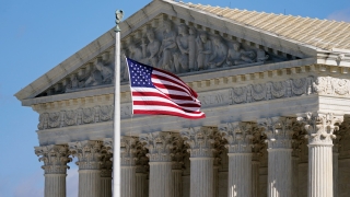 An American flag waves in front of the Supreme Court building on Capitol Hill in Washington, on Nov. 2, 2020. Days after the Supreme Court outlawed affirmative action in college admissions on June 29, 2023, activists say they will sue Harvard over its use of legacy preferences for children of alumni. (AP Photo/Patrick Semansky, File)
